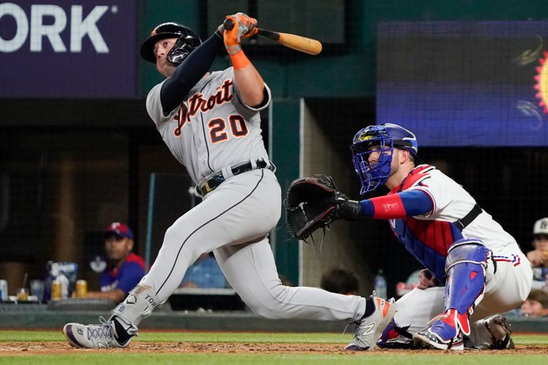 Jun 29, 2023; Arlington, Texas, USA; Detroit Tigers first baseman Spencer Torkelson (20) follows thru on a three run home run during the eighth inning against the Texas Rangers at Globe Life Field. Mandatory Credit: Raymond Carlin III-USA TODAY Sports