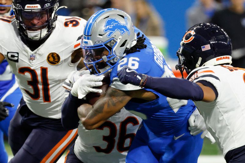 Detroit Lions running back Jahmyr Gibbs (26) rushes against the Chicago Bears in the first half of an NFL football game in Detroit, Thursday, Nov. 28, 2024. (AP Photo/Rick Osentoski)