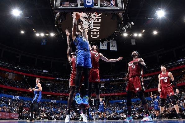 ORLANDO, FL - DECEMBER 20: Wendell Carter Jr. #34 of the Orlando Magic drives to the basket during the game against the Miami Heat on December 20, 2023 at the Kia Center in Orlando, Florida. NOTE TO USER: User expressly acknowledges and agrees that, by downloading and or using this photograph, User is consenting to the terms and conditions of the Getty Images License Agreement. Mandatory Copyright Notice: Copyright 2023 NBAE (Photo by Fernando Medina/NBAE via Getty Images)