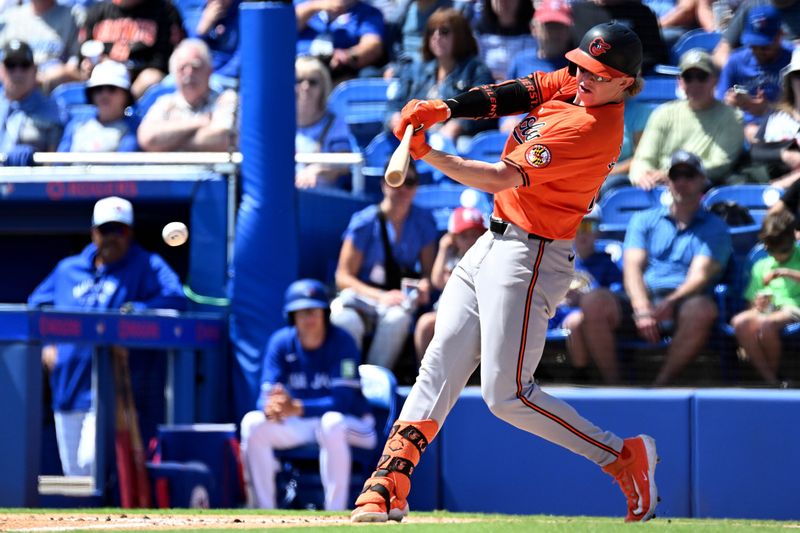 Mar 19, 2024; Dunedin, Florida, USA; Baltimore Orioles right fielder Heston Kjerstad (13) hits a single in the second  inning of the spring training game against the Toronto Blue Jays at TD Ballpark. Mandatory Credit: Jonathan Dyer-USA TODAY Sports