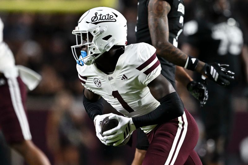 Oct 4, 2025; College Station, Texas, USA; Mississippi State Bulldogs cornerback Kelley Jones (1) runs the ball after catching an interception during the second quarter against the Texas A&M Aggies at Kyle Field. Mandatory Credit: Maria Lysaker-Imagn Images 