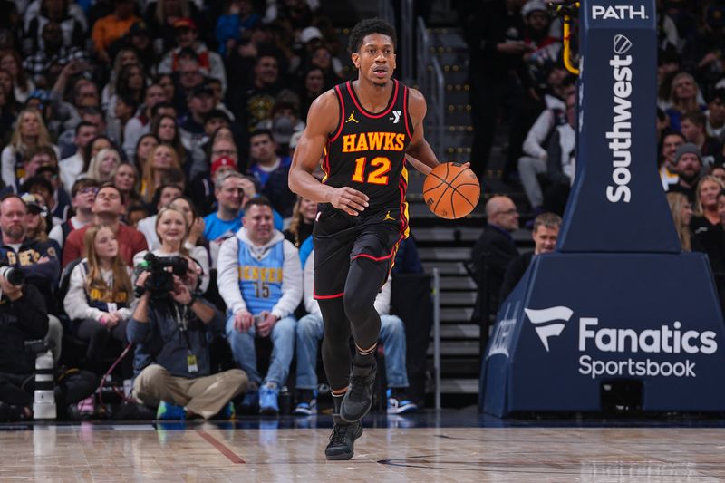 DENVER, CO - JANUARY 1: De'Andre Hunter #12 of the Atlanta Hawks dribbles the ball during the game against the Denver Nuggets on January 1, 2025 at Ball Arena in Denver, Colorado. NOTE TO USER: User expressly acknowledges and agrees that, by downloading and/or using this Photograph, user is consenting to the terms and conditions of the Getty Images License Agreement. Mandatory Copyright Notice: Copyright 2025 NBAE (Photo by Bart Young/NBAE via Getty Images)