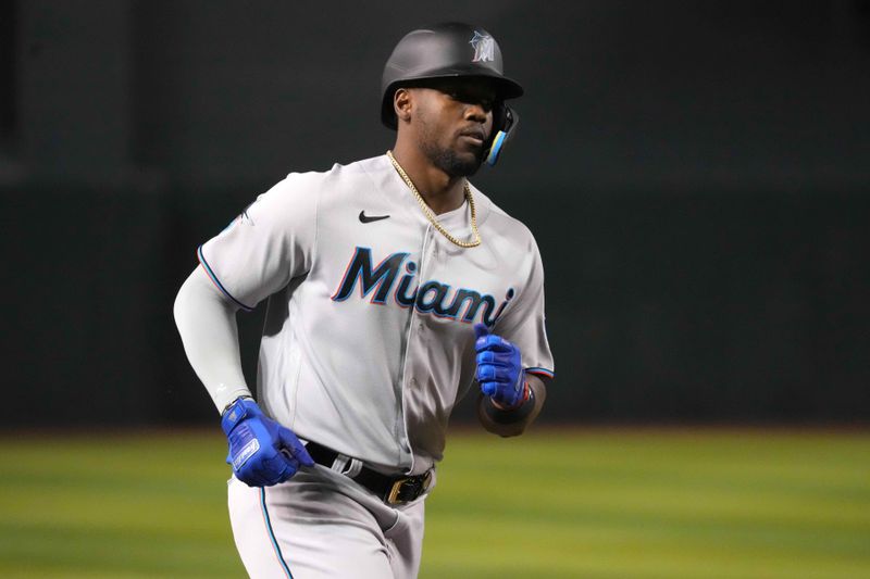 May 9, 2023; Phoenix, Arizona, USA; Miami Marlins designated hitter Jorge Soler (12) runs the bases after hitting a home run against the Arizona Diamondbacks during the fifth inning at Chase Field. Mandatory Credit: Joe Camporeale-USA TODAY Sports