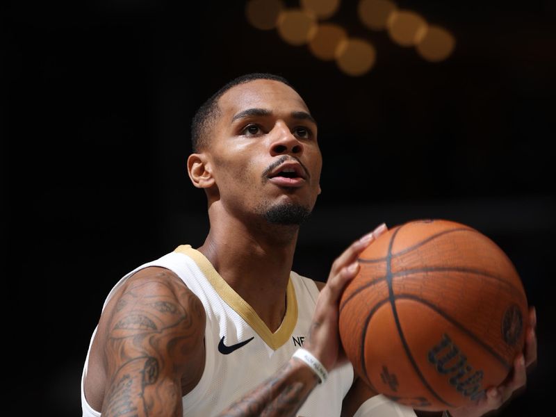 MEMPHIS, TN - NOVEMBER 29: Dejounte Murray #5 of the New Orleans Pelicans shoots a free throw during the game against the Memphis Grizzlies during the Emirates NBA Cup game on November 29, 2024 at FedExForum in Memphis, Tennessee. NOTE TO USER: User expressly acknowledges and agrees that, by downloading and or using this photograph, User is consenting to the terms and conditions of the Getty Images License Agreement. Mandatory Copyright Notice: Copyright 2024 NBAE (Photo by Joe Murphy/NBAE via Getty Images)