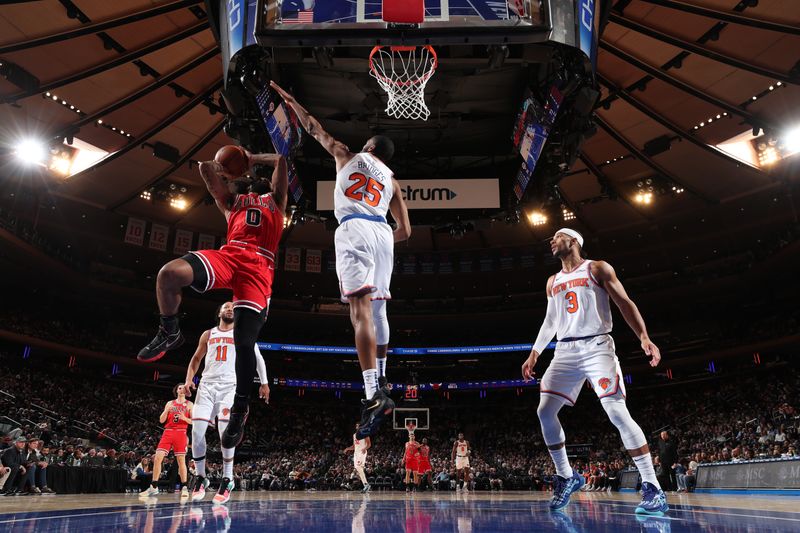 NEW YORK, NY - NOVEMBER 13: Coby White #0 of the Chicago Bulls drives to the basket during the game against the New York Knicks on November 13, 2024 at Madison Square Garden in New York City, New York.  NOTE TO USER: User expressly acknowledges and agrees that, by downloading and or using this photograph, User is consenting to the terms and conditions of the Getty Images License Agreement. Mandatory Copyright Notice: Copyright 2024 NBAE  (Photo by Joe Murphy/NBAE via Getty Images)