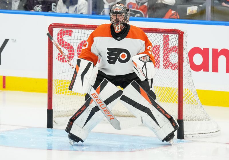 Feb 15, 2024; Toronto, Ontario, CAN; Philadelphia Flyers goaltender Samuel Ersson (33) tends the net during the warmup against the Toronto Maple Leafs at Scotiabank Arena. Mandatory Credit: Nick Turchiaro-USA TODAY Sports