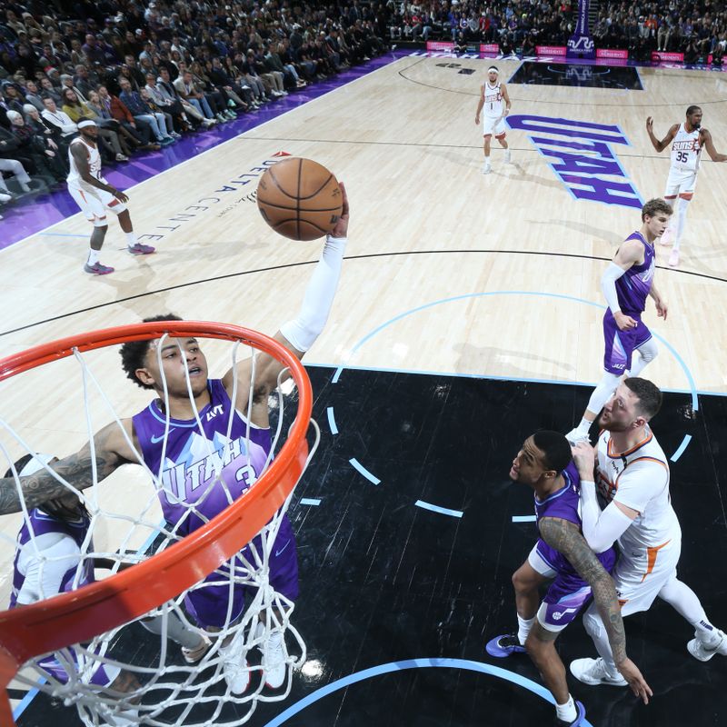 SALT LAKE CITY, UT - DECEMBER 13: Keyonte George #3 of the Utah Jazz grabs the rebound during the game against the Phoenix Suns  during a regular season game on December 13, 2024 at Delta Center in Salt Lake City, Utah. NOTE TO USER: User expressly acknowledges and agrees that, by downloading and or using this Photograph, User is consenting to the terms and conditions of the Getty Images License Agreement. Mandatory Copyright Notice: Copyright 2024 NBAE (Photo by Melissa Majchrzak/NBAE via Getty Images)