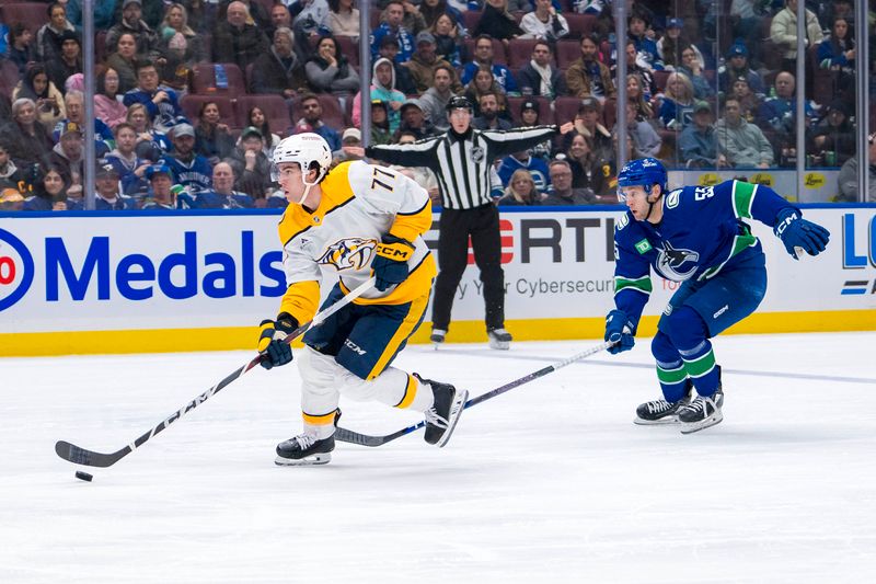 Jan 3, 2025; Vancouver, British Columbia, CAN; Vancouver Canucks forward Teddy Blueger (53) watches Nashville Predators forward Luke Evangelista (77) skate in on a breakaway in the third period at Rogers Arena. Mandatory Credit: Bob Frid-Imagn Images