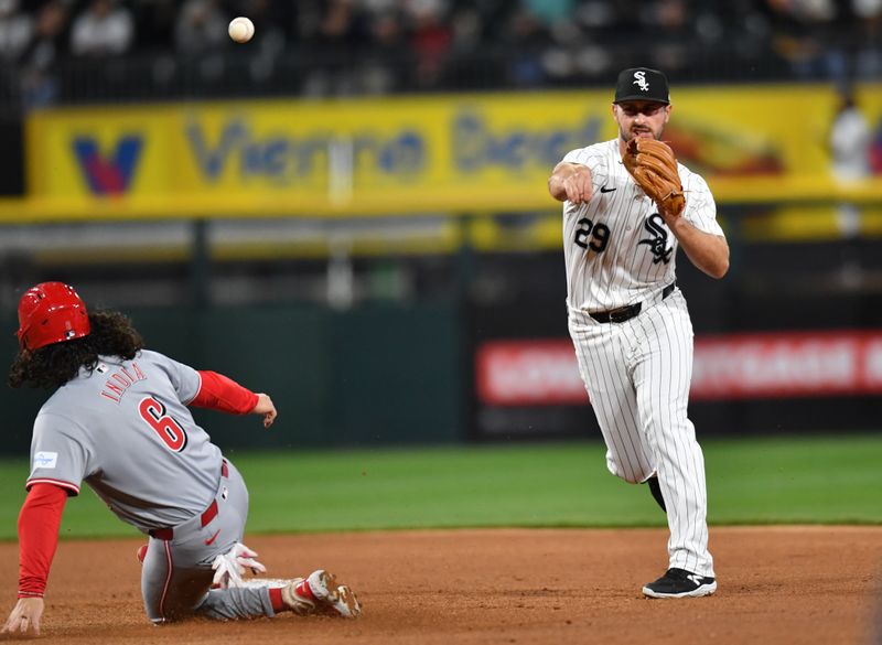 Apr 12, 2024; Chicago, Illinois, USA; Chicago White Sox shortstop Paul DeJong (29) completes a double play after forcing out Cincinnati Reds second base Jonathan India (6) during the sixth inning at Guaranteed Rate Field. Mandatory Credit: Patrick Gorski-USA TODAY Sports