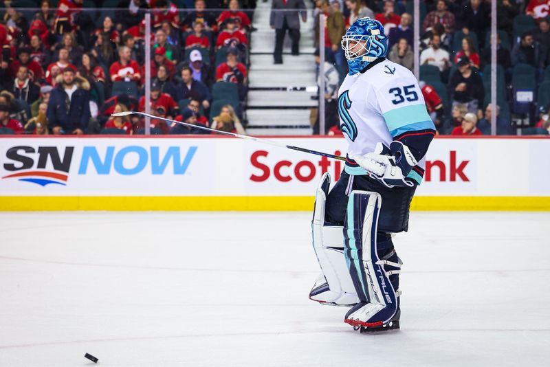 Nov 1, 2022; Calgary, Alberta, CAN; Seattle Kraken goaltender Joey Daccord (35) celebrates win over the Calgary Flames at Scotiabank Saddledome. Mandatory Credit: Sergei Belski-USA TODAY Sports