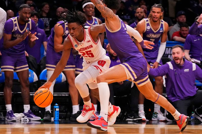 Mar 22, 2024; Brooklyn, NY, USA; Wisconsin Badgers guard John Blackwell (25) dribbles the ball against James Madison Dukes guard Terrence Edwards Jr. (5) in the first round of the 2024 NCAA Tournament at the Barclays Center.  Mandatory Credit: Robert Deutsch-USA TODAY Sports