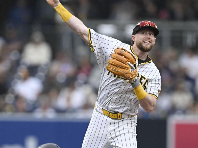 May 28, 2025; San Diego, California, USA; San Diego Padres second baseman Jake Cronenworth (9) throws over Miami Marlins catcher Nick Fortes (4) as he tries to turn a double play during the eighth inning at Petco Park. Machado was charged with an error on the play. Mandatory Credit: Denis Poroy-Imagn Images