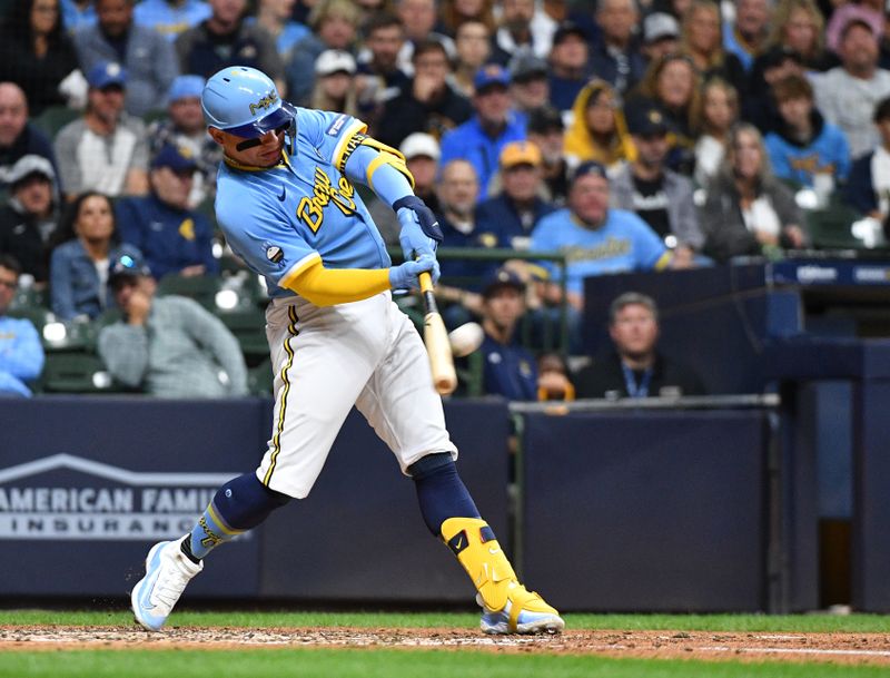 Sep 15, 2023; Milwaukee, Wisconsin, USA; Milwaukee Brewers catcher William Contreras (24) hits a home run against the Washington Nationals in the fifth inning at American Family Field. Mandatory Credit: Michael McLoone-USA TODAY Sports