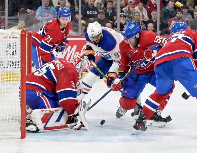 Jan 13, 2024; Montreal, Quebec, CAN; Loose puck in front of Montreal Canadiens goalie Sam Montembeault (35) and teammate defenseman David Savard (58) and Edmonton Oilers forward Evander Kane (91) during the third period at the Bell Centre. Mandatory Credit: Eric Bolte-USA TODAY Sports