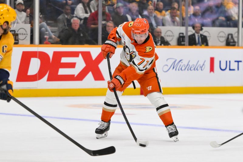 Oct 21, 2025; Nashville, Tennessee, USA;  Anaheim Ducks right wing Frank Vatrano (77) shoots against the Nashville Predators during the second period at Bridgestone Arena. Mandatory Credit: Steve Roberts-Imagn Images