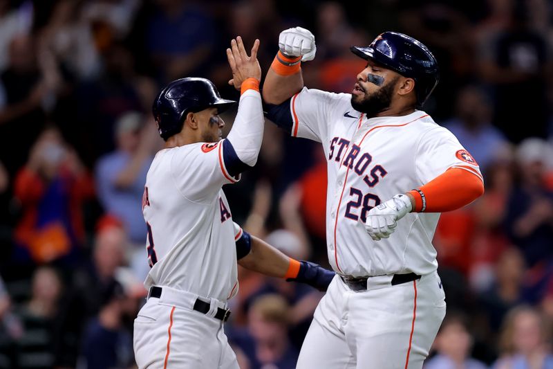 May 5, 2024; Houston, Texas, USA; Houston Astros first baseman Jon Singleton (28) is congratulated by Houston Astros shortstop Jeremy Pena (3) after hitting a two-run home run to right field against the Seattle Mariners during the seventh inning at Minute Maid Park. Mandatory Credit: Erik Williams-USA TODAY Sports