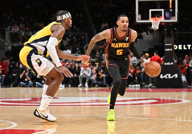 ATLANTA, GEORGIA - JANUARY 12: Dejounte Murray #5 of the Atlanta Hawks dribbles the ball during the game against the Indiana Pacers on January 12, 2024 at State Farm Arena in Atlanta, Georgia.  NOTE TO USER: User expressly acknowledges and agrees that, by downloading and or using this photograph, User is consenting to the terms and conditions of the Getty Images License Agreement. (Photo by Paras Griffin/Getty Images)