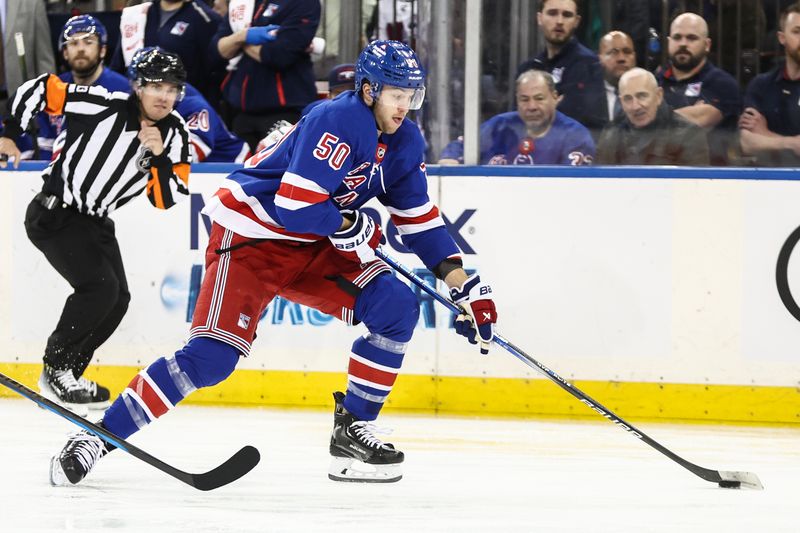 Apr 7, 2024; New York, New York, USA;  New York Rangers left wing Will Cuylle (50) controls the puck in the second period against the Montreal Canadiens at Madison Square Garden. Mandatory Credit: Wendell Cruz-USA TODAY Sports