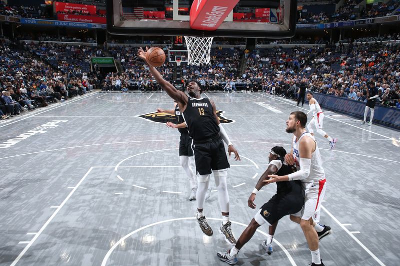 MEMPHIS, TN - FEBRUARY 23: Jaren Jackson Jr. #13 of the Memphis Grizzlies rebounds the ball during the game against the LA Clippers on February 23, 2024 at FedExForum in Memphis, Tennessee. NOTE TO USER: User expressly acknowledges and agrees that, by downloading and or using this photograph, User is consenting to the terms and conditions of the Getty Images License Agreement. Mandatory Copyright Notice: Copyright 2024 NBAE (Photo by Joe Murphy/NBAE via Getty Images)