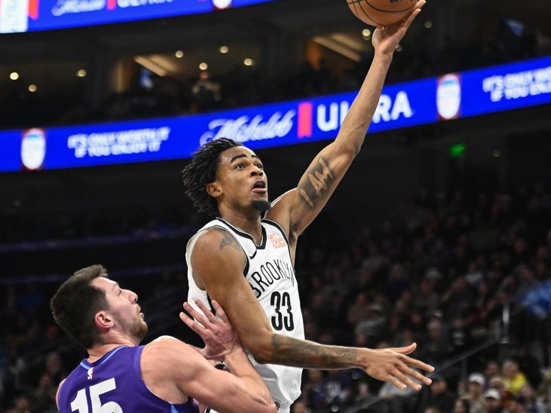 SALT LAKE CITY, UTAH - JANUARY 12: Nic Claxton #33 of the Brooklyn Nets shoots over Drew Eubanks #15 of the Utah Jazz during the second half of a game at Delta Center on January 12, 2025 in Salt Lake City, Utah. NOTE TO USER: User expressly acknowledges and agrees that, by downloading and or using this photograph, User is consenting to the terms and conditions of the Getty Images License Agreement.   (Photo by Alex Goodlett/Getty Images)