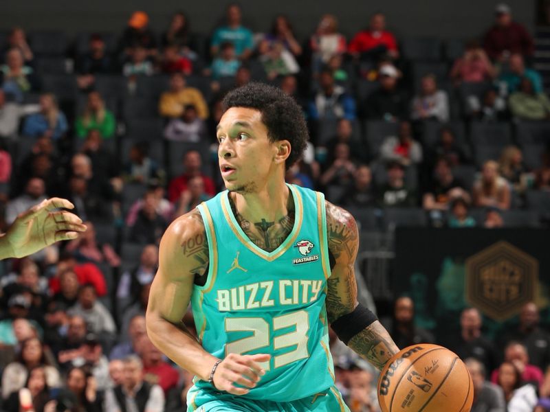 CHARLOTTE, NC - MARCH 27: Tre Mann #23 of the  Charlotte Hornets handles the ball during the game  on March 27, 2024 at Spectrum Center in Charlotte, North Carolina. NOTE TO USER: User expressly acknowledges and agrees that, by downloading and or using this photograph, User is consenting to the terms and conditions of the Getty Images License Agreement. Mandatory Copyright Notice: Copyright 2024 NBAE (Photo by Kent Smith/NBAE via Getty Images)