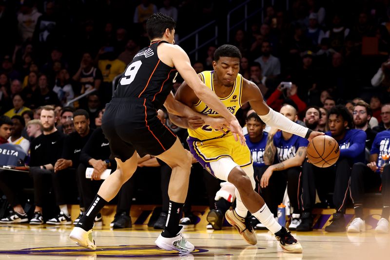 LOS ANGELES, CALIFORNIA - FEBRUARY 13: Rui Hachimura #28 of the Los Angeles Lakers drives to the basket against Ausar Thompson #9 of the Detroit Pistons during the first quarter at Crypto.com Arena on February 13, 2024 in Los Angeles, California. NOTE TO USER: User expressly acknowledges and agrees that, by downloading and or using this photograph, user is consenting to the terms and conditions of the Getty Images License Agreement.  (Photo by Katelyn Mulcahy/Getty Images)