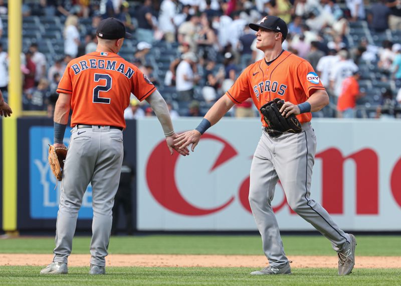 Aug 6, 2023; Bronx, New York, USA; Houston Astros center fielder Jake Meyers (6) celebrates with third baseman Alex Bregman (2) after defeating the New York Yankees at Yankee Stadium. Mandatory Credit: Vincent Carchietta-USA TODAY Sports