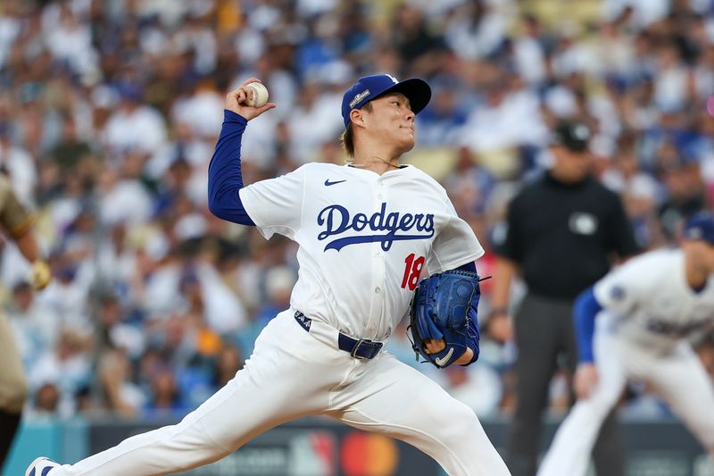 Oct 5, 2024; Los Angeles, California, USA; Los Angeles pitcher Yoshinobu Yamamoto (18) throws a pitch in the first inning against the San Diego Padres during game one of the NLDS for the 2024 MLB Playoffs at Dodger Stadium. Mandatory Credit: Kiyoshi Mio-Imagn Images