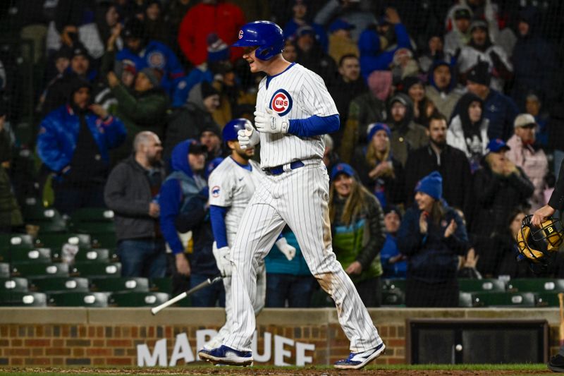 Apr 2, 2024; Chicago, Illinois, USA; Chicago Cubs first baseman Garrett Cooper (41) after he hits a three run homer run against the Colorado Rockies during the sixth inning at Wrigley Field. Mandatory Credit: Matt Marton-USA TODAY Sports