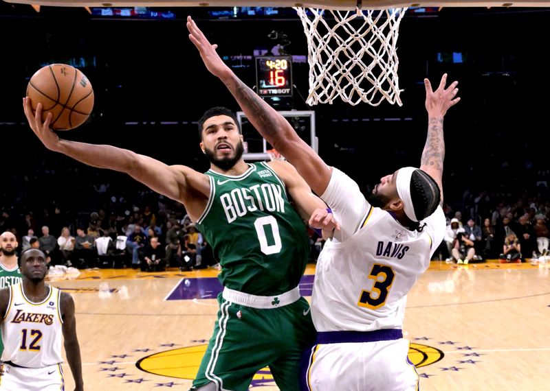 LOS ANGELES, CALIFORNIA - DECEMBER 25: Jayson Tatum #0 of the Boston Celtics drives over Anthony Davis #3 of the Los Angeles Lakers in the second half at Crypto.com Arena on December 25, 2023 in Los Angeles, California. NOTE TO USER: User expressly acknowledges and agrees that, by downloading and or using this photograph, User is consenting to the terms and conditions of the Getty Images License Agreement.(Photo by Jayne Kamin-Oncea/Getty Images)