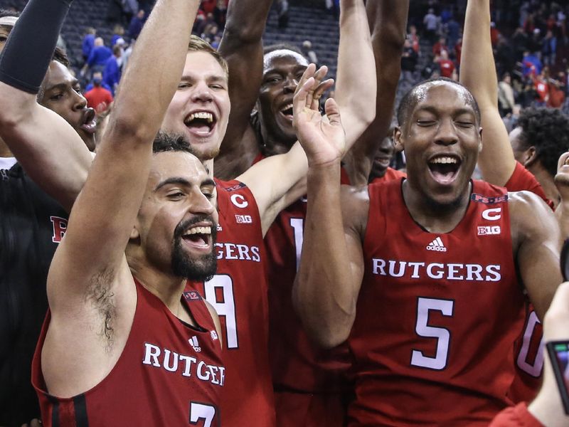 Dec 9, 2023; Newark, New Jersey, USA; The Rutgers Scarlet Knights celebrate after defeating the Seton Hall Pirates 70-63 at Prudential Center. Mandatory Credit: Wendell Cruz-USA TODAY Sports