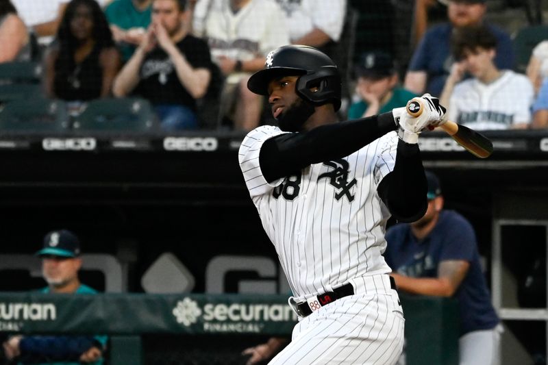 Aug 22, 2023; Chicago, Illinois, USA; Chicago White Sox centerfielder Luis Robert Jr. (88) hits an single against the Seattle Mariners during the first inning at Guaranteed Rate Field. Mandatory Credit: Matt Marton-USA TODAY Sports