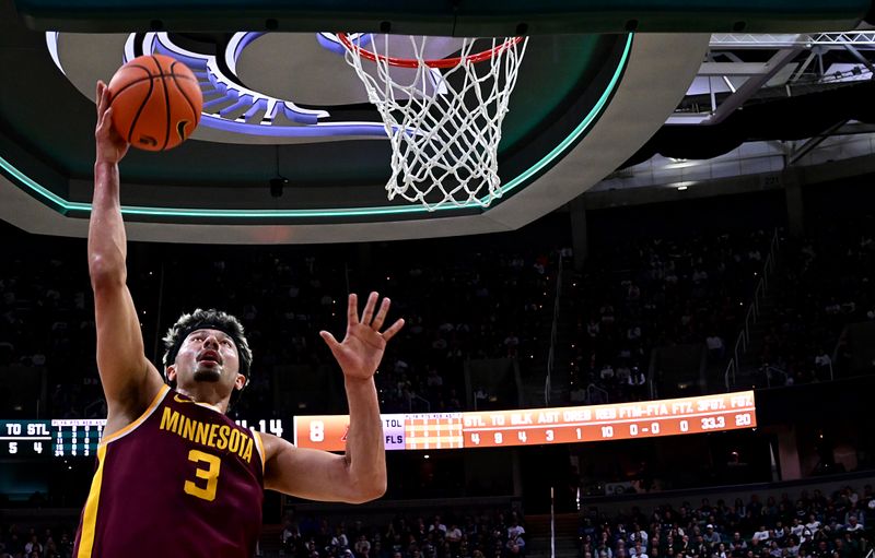 Jan 28, 2025; East Lansing, Michigan, USA;  Minnesota Golden Gophers forward Dawson Garcia (3) takes the ball to the basket against the Michigan State Spartans during the first half at Jack Breslin Student Events Center. Mandatory Credit: Dale Young-Imagn Images
