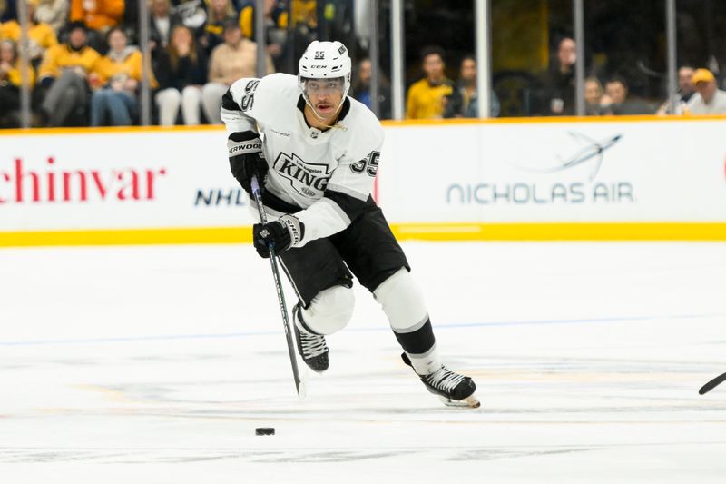 Nov 4, 2024; Nashville, Tennessee, USA;  Los Angeles Kings right wing Quinton Byfield (55) skates with the puck against the Nashville Predators during the second period at Bridgestone Arena. Mandatory Credit: Steve Roberts-Imagn Images