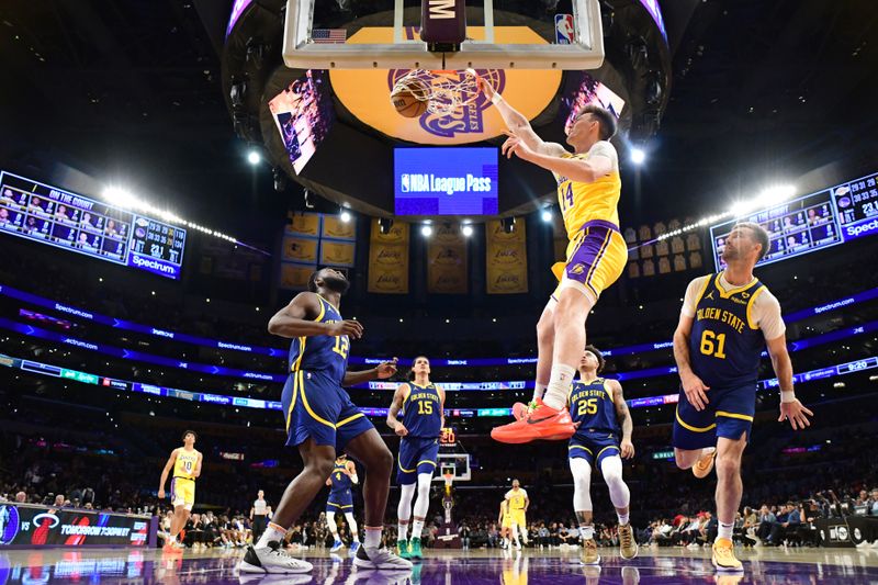 LOS ANGELES, CA - APRIL 9: Colin Castleton #14 of the Los Angeles Lakers dunks the ball during the game against the Golden State Warriors on April 9, 2024 at Crypto.Com Arena in Los Angeles, California. NOTE TO USER: User expressly acknowledges and agrees that, by downloading and/or using this Photograph, user is consenting to the terms and conditions of the Getty Images License Agreement. Mandatory Copyright Notice: Copyright 2024 NBAE (Photo by Adam Pantozzi/NBAE via Getty Images)