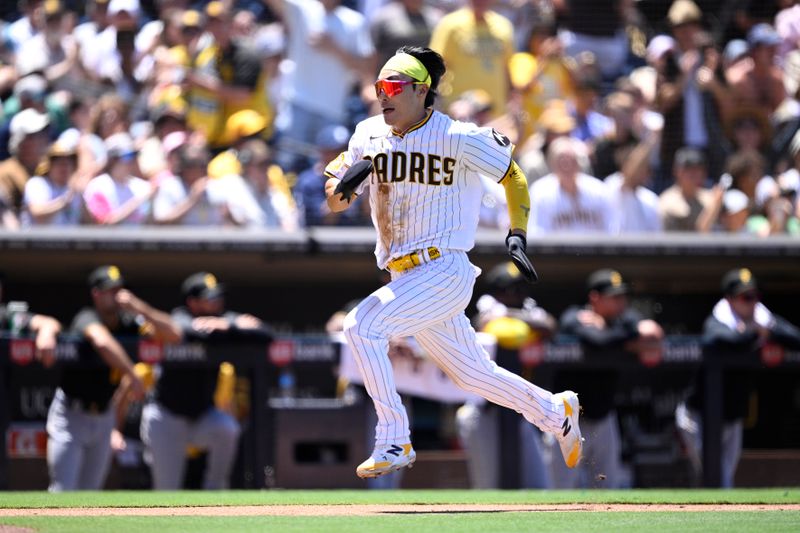 Jul 26, 2023; San Diego, California, USA; San Diego Padres second baseman Ha-seong Kim (7) advances home to score a run against the Pittsburgh Pirates during the third inning at Petco Park. Mandatory Credit: Orlando Ramirez-USA TODAY Sports