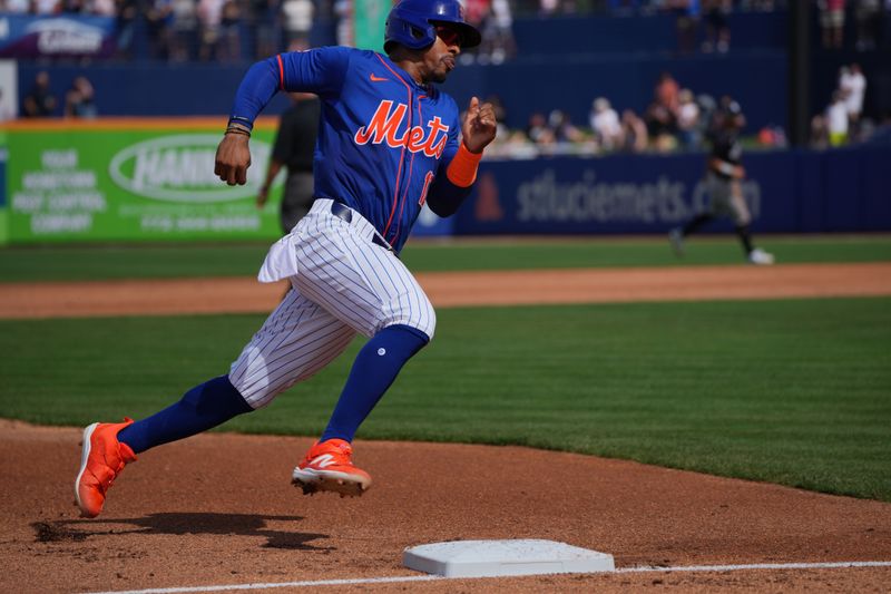 Mar 5, 2024; Port St. Lucie, Florida, USA;  New York Mets shortstop Francisco Lindor (12) rounds third base and scores on a base hit in the third inning against the New York Yankees at Clover Park. Mandatory Credit: Jim Rassol-USA TODAY Sports