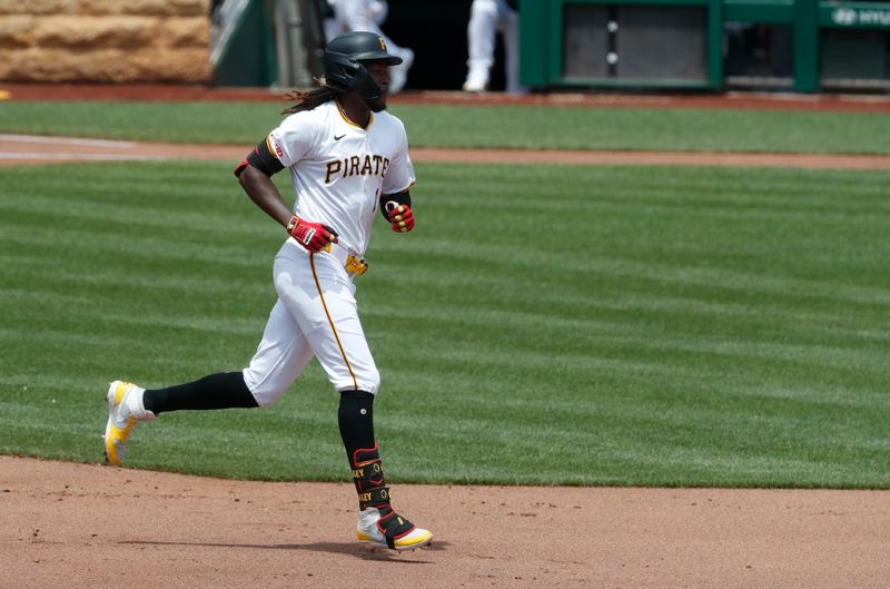 Jul 8, 2024; Pittsburgh, Pennsylvania, USA;  Pittsburgh Pirates shortstop Oneil Cruz (15) rounds the bases on a two run home run against the New York Mets during the fourth inning at PNC Park. Mandatory Credit: Charles LeClaire-USA TODAY Sports