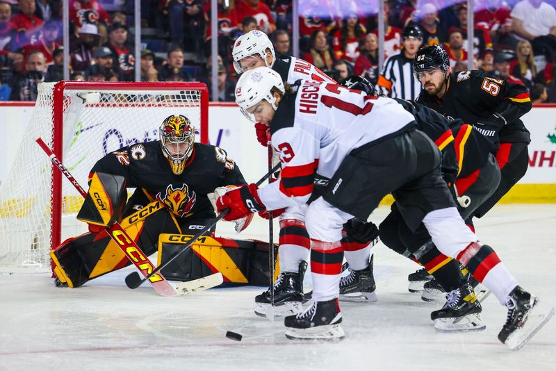 Dec 9, 2023; Calgary, Alberta, CAN; Calgary Flames goaltender Dustin Wolf (32) guards his net against the New Jersey Devils during the third period at Scotiabank Saddledome. Mandatory Credit: Sergei Belski-USA TODAY Sports