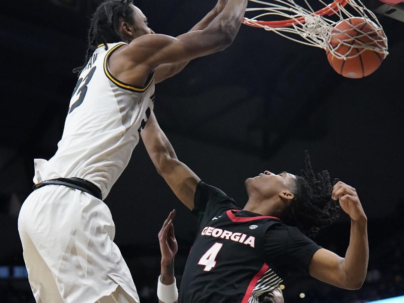 Jan 6, 2024; Columbia, Missouri, USA; Missouri Tigers forward Aidan Shaw (23) dunks the ball as Georgia Bulldogs guard Silas Demary Jr. (4) defends during the first half at Mizzou Arena. Mandatory Credit: Denny Medley-USA TODAY Sports