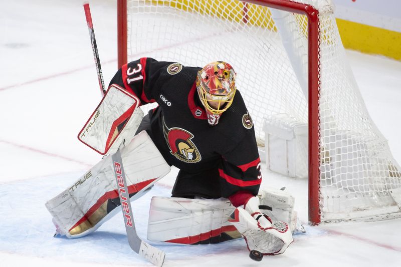 Feb 13, 2024; Ottawa, Ontario, CAN; Ottawa Senators goalie Anton Forsberg (31) makes a save in the third period against the Columbus Blue Jackets at the Canadian Tire Centre. Mandatory Credit: Marc DesRosiers-USA TODAY Sports