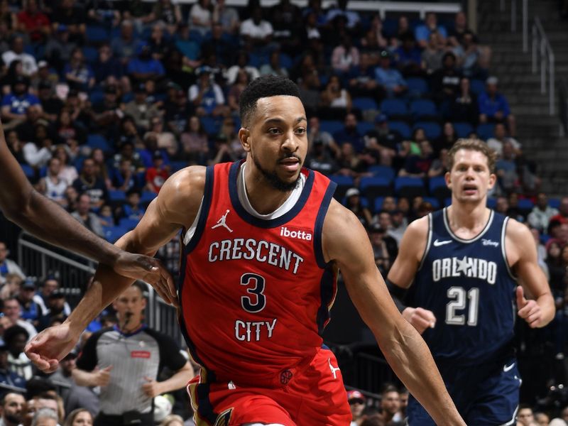 ORLANDO, FL - MARCH 21: CJ McCollum #3 of the New Orleans Pelicans dribbles the ball during the game against the Orlando Magic on March 21, 2024 at Amway Center in Orlando, Florida. NOTE TO USER: User expressly acknowledges and agrees that, by downloading and or using this photograph, User is consenting to the terms and conditions of the Getty Images License Agreement. Mandatory Copyright Notice: Copyright 2024 NBAE (Photo by Fernando Medina/NBAE via Getty Images)