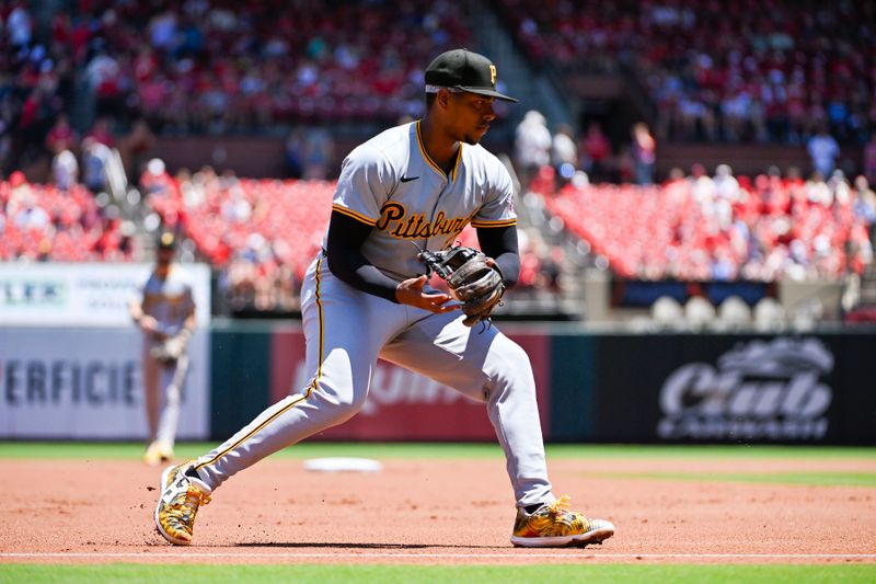 Jun 13, 2024; St. Louis, Missouri, USA;  Pittsburgh Pirates third baseman Ke'Bryan Hayes (13) fields a ground ball against the St. Louis Cardinals during the first inning at Busch Stadium. Mandatory Credit: Jeff Curry-USA TODAY Sports