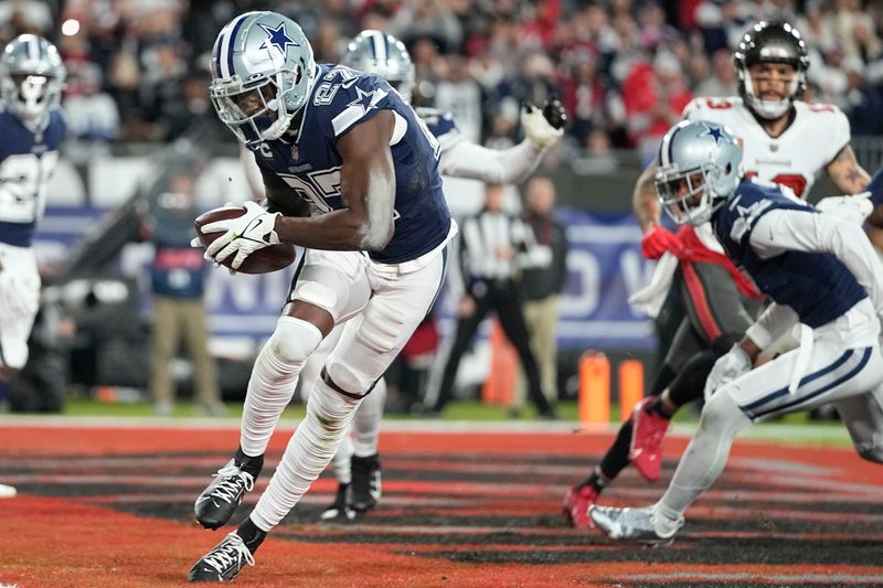 Dallas Cowboys safety Jayron Kearse (27) runs in the end zone after his interception against the Tampa Bay Buccaneers during the first half of an NFL wild-card football game, Monday, Jan. 16, 2023, in Tampa, Fla. (AP Photo/Chris Carlson)