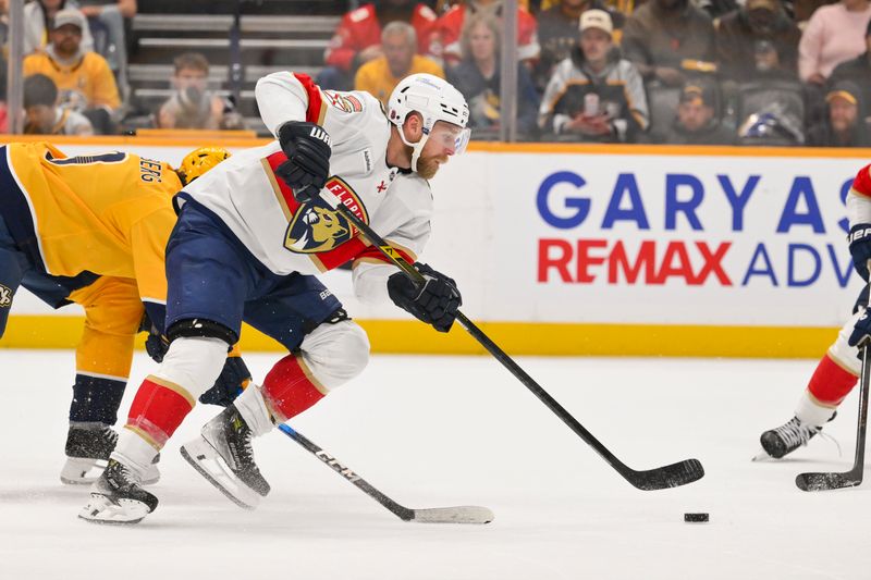 Nov 24, 2025; Nashville, Tennessee, USA;  Florida Panthers center Sam Bennett (9) skates with the puck against the Nashville Predators during the second period at Bridgestone Arena. Mandatory Credit: Steve Roberts-Imagn Images