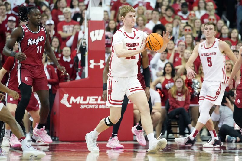 Feb 18, 2023; Madison, Wisconsin, USA;  Wisconsin Badgers forward Steven Crowl (22) passes the ball during the first half against the Rutgers Scarlet Knights at the Kohl Center. Mandatory Credit: Kayla Wolf-USA TODAY Sports