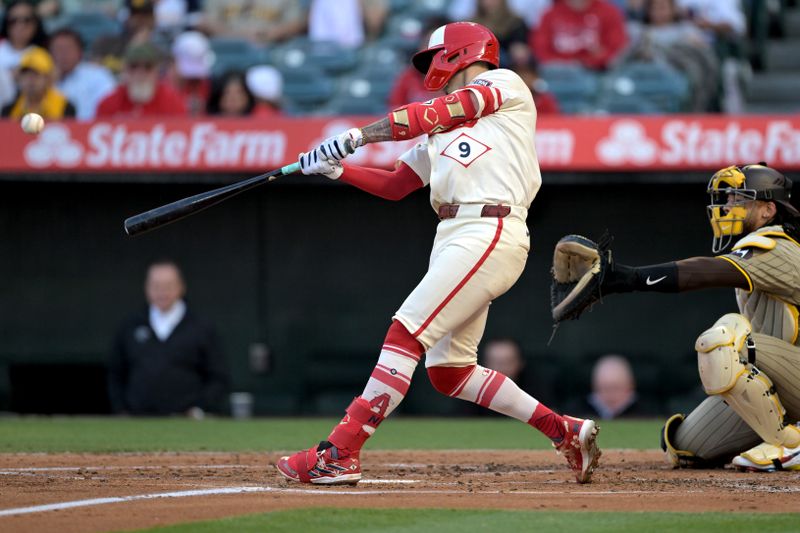 Jun 5, 2024; Anaheim, California, USA;  Los Angeles Angels shortstop Zach Neto (9) hits a  two-run home run in the second inning against the San Diego Padres at Angel Stadium. Mandatory Credit: Jayne Kamin-Oncea-USA TODAY Sports