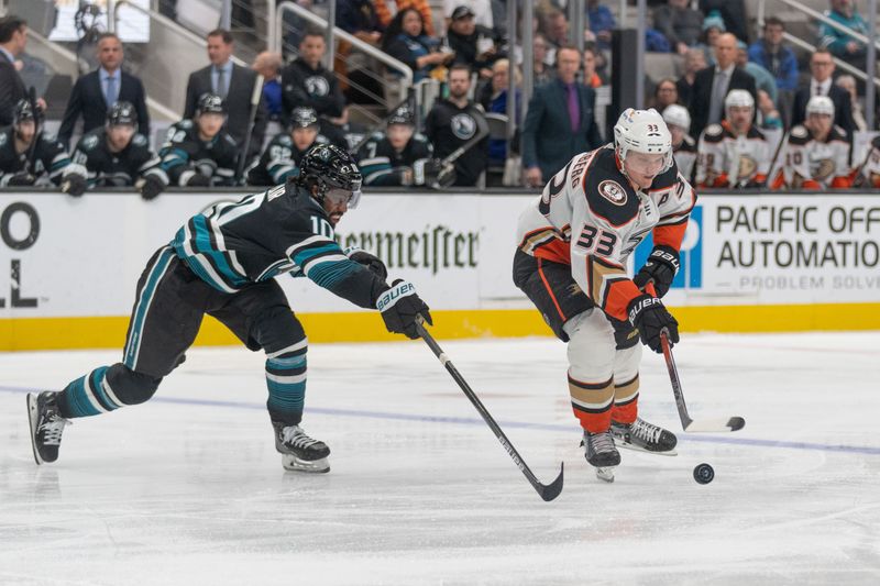 Feb 29, 2024; San Jose, California, USA; San Jose Sharks left wing Anthony Duclair (10) attempts to defend against Anaheim Ducks right wing Jakob Silfverberg (33) during the third period at SAP Center at San Jose. Mandatory Credit: Stan Szeto-USA TODAY Sports