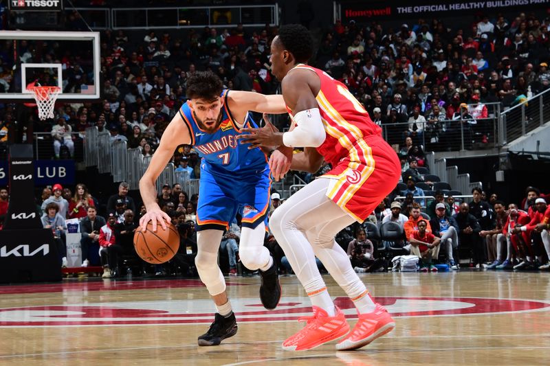 ATLANTA, GA - JANUARY 3: Chet Holmgren #7 of the Oklahoma City Thunder handles the ball during the game against the Atlanta Hawks on January 3, 2024 at State Farm Arena in Atlanta, Georgia.  NOTE TO USER: User expressly acknowledges and agrees that, by downloading and/or using this Photograph, user is consenting to the terms and conditions of the Getty Images License Agreement. Mandatory Copyright Notice: Copyright 2024 NBAE (Photo by Scott Cunningham/NBAE via Getty Images)