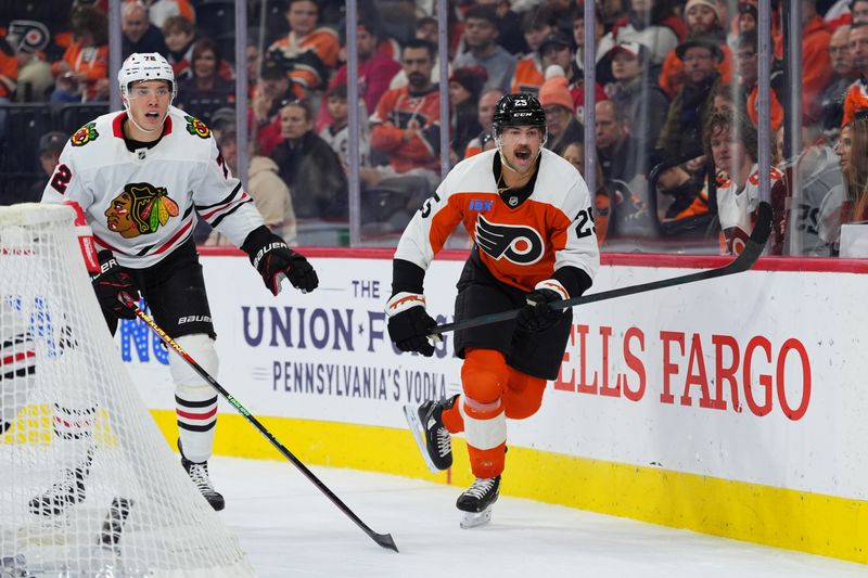 Nov 23, 2024; Philadelphia, Pennsylvania, USA; Philadelphia Flyers center Ryan Poehling (25) reacts against Chicago Blackhawks defenseman Alex Vlasic (72) in the first period at Wells Fargo Center. Mandatory Credit: Kyle Ross-Imagn Images